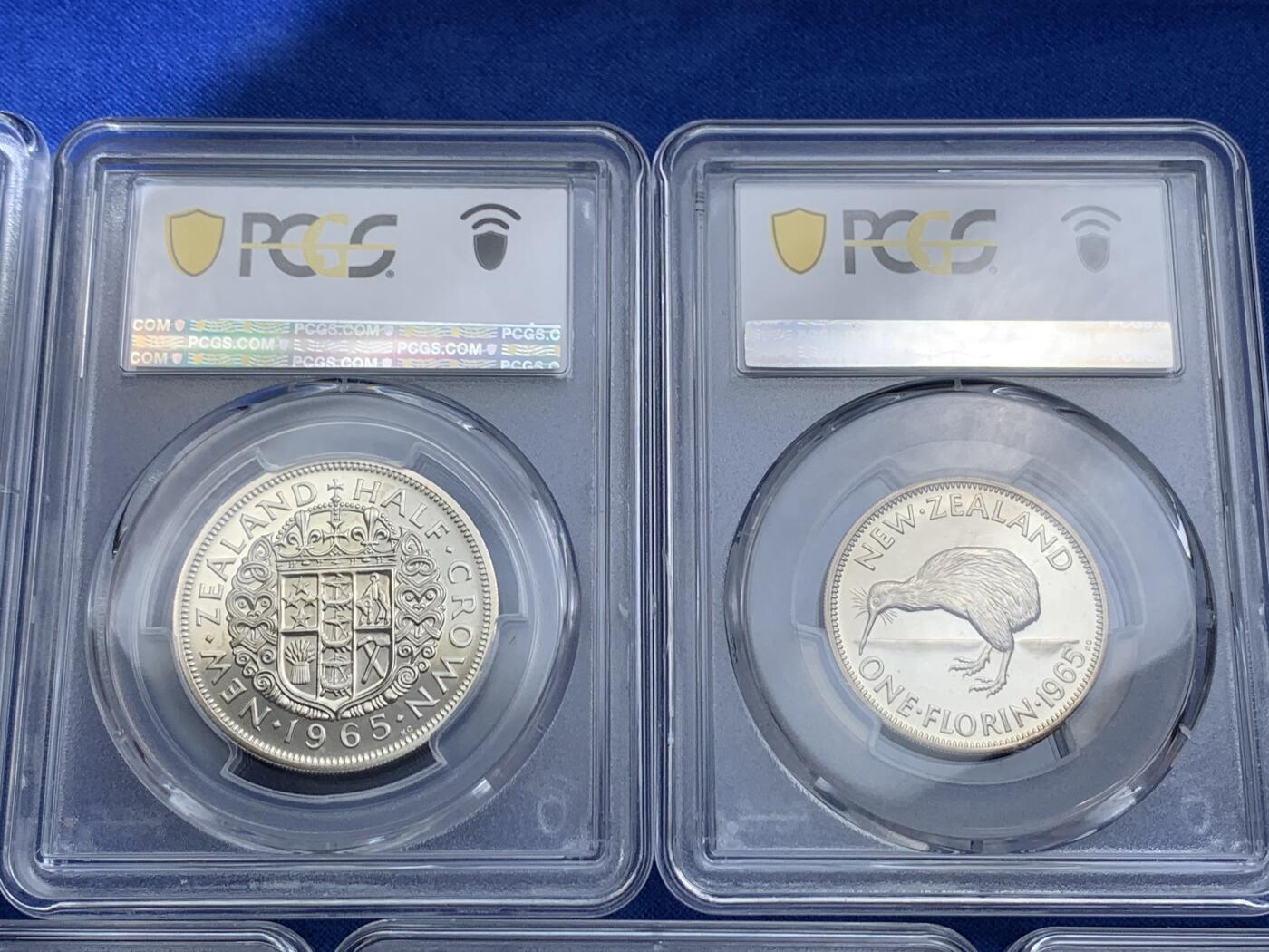 《竞宝斋》第414场 周日，周一，2场连拍 （全场包邮） 七枚一组 PCGS SP65-67 新西兰1965年伊丽莎白二世SP祥币1/2便士至1/2克朗，1965样币级七枚套相当罕见，Stering币制的关门年份。高分收藏级品相，从乔五开始的经典图案一直未变