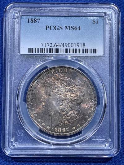 《竞宝斋》第415场 周日，周一，2场连拍 （全场包邮） - PCGS MS64 美国1887年摩根1美元银币 正面五彩包浆 反面有环状金色包浆
