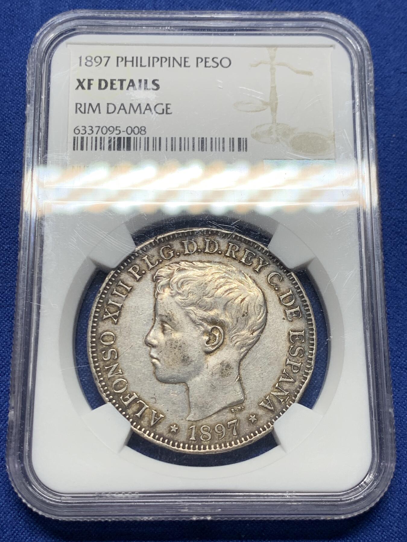 《竞宝斋》第415场 周日，周一，2场连拍 （全场包邮） NGC XFD 西属菲律宾1897年1比索大银币，稀少。