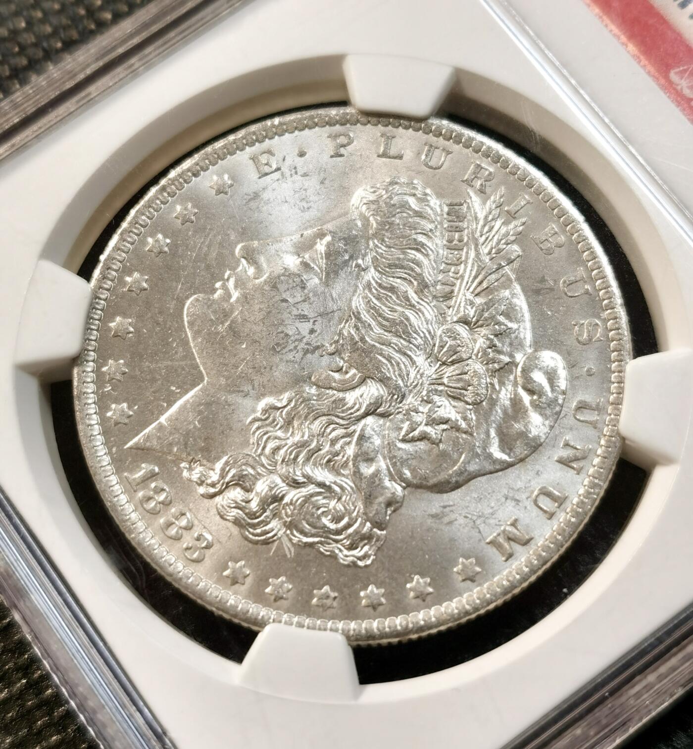 甄臻铺-世界币章拍卖（第32期），送拍享返佣金等优惠多多 NGC-MS63 1883年O版摩根，不多见的年份，美国标签，品相不输64