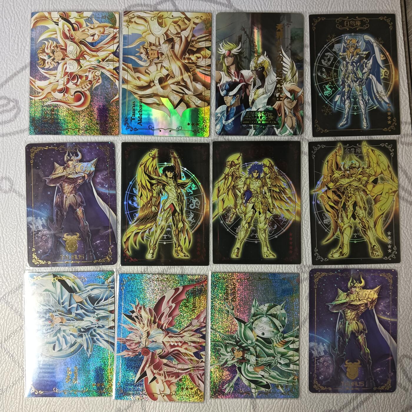 花开卡拍第37期（9月7号周日截拍，品控勿拍!!!拍品不寄存，运费5元，自制卡难免瑕疵，可能存在轻微撞角爆边等出厂瑕疵，品控介意勿拍！） 圣斗士卡牌 黄金圣衣等共12张 彩闪砂闪等