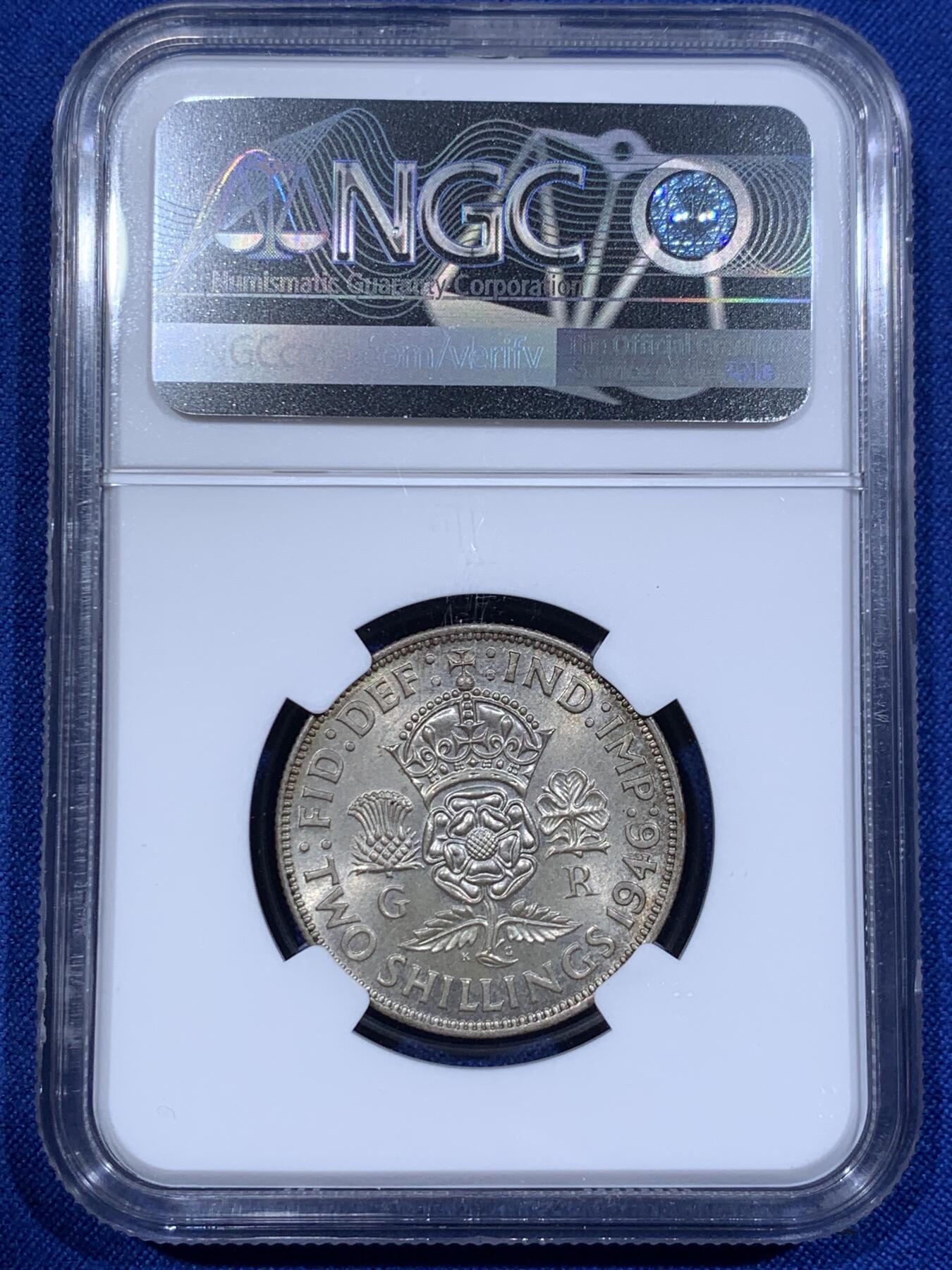 《竞宝斋》第416场 周日，周一，2场连拍 （全场包邮） NGC MS64 英国1946年乔六1弗洛林银币，1福林=两先令。淡彩转光，标准BU状态。流通版上64分难度颇大，英系玩家流通套必备