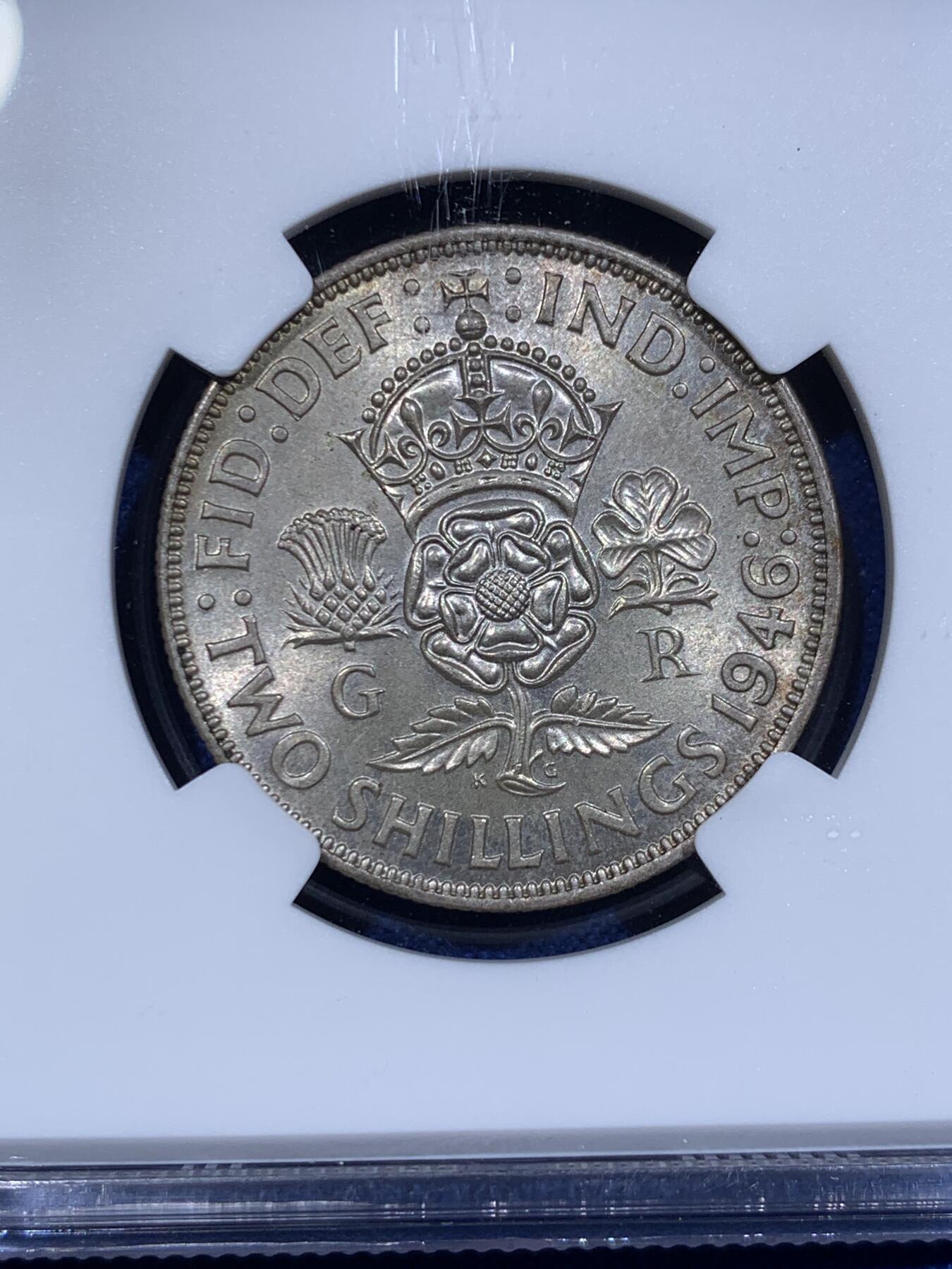 《竞宝斋》第416场 周日，周一，2场连拍 （全场包邮） NGC MS64 英国1946年乔六1弗洛林银币，1福林=两先令。淡彩转光，标准BU状态。流通版上64分难度颇大，英系玩家流通套必备