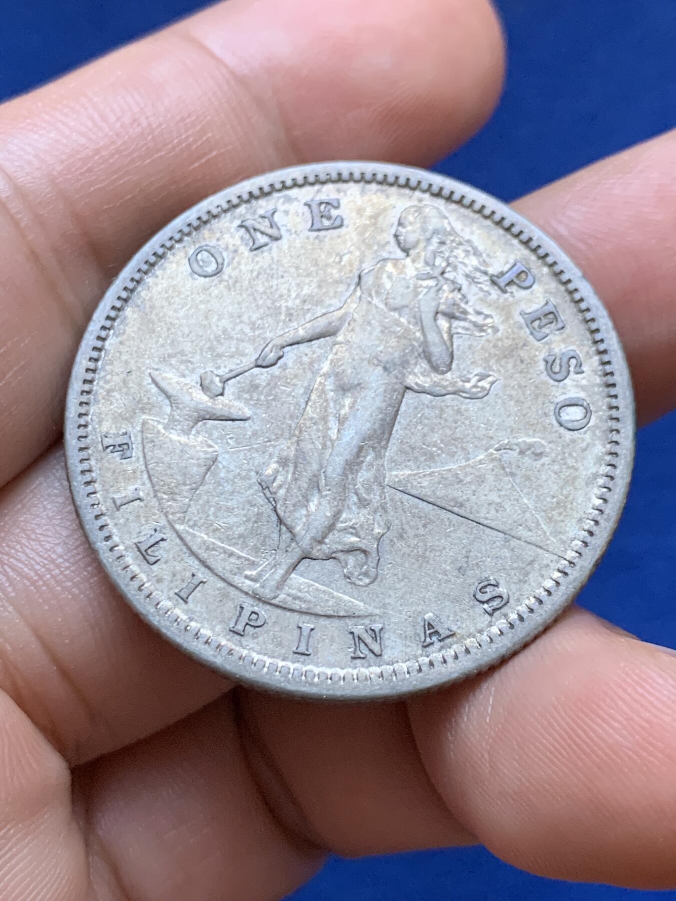 《竞宝斋》第417场 周日，周一，2场连拍 （全场包邮） 美属菲律宾1907年打铁1比索银币，带点包浆。