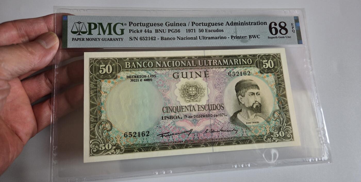pmg评级币 葡属几内亚50埃斯库多  pmg68 亚军分 冠军分只有一张 无347靓号 探险家、奴隶商人努诺·特里1971