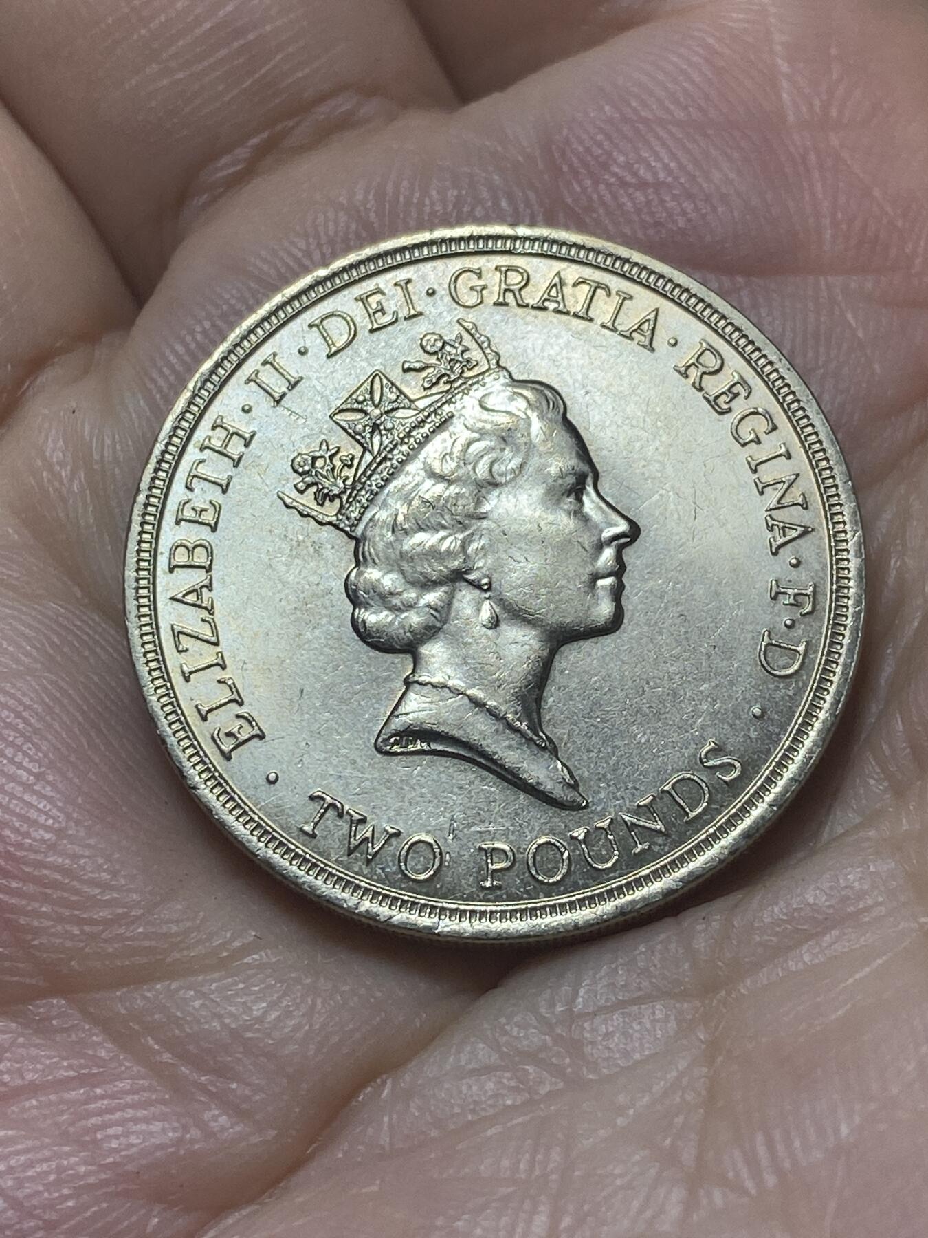 2025年第八十八场(总第一百一十四场）外国好品散币(免佣金) 英国🇬🇧1986单年份2英镑(第十三届英联邦运动会纪念币，首枚2镑面值硬币)