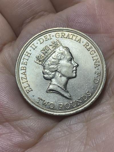 2025年第八十八场(总第一百一十四场）外国好品散币(免佣金) 英国🇬🇧1986单年份2英镑(第十三届英联邦运动会纪念币，首枚2镑面值硬币)