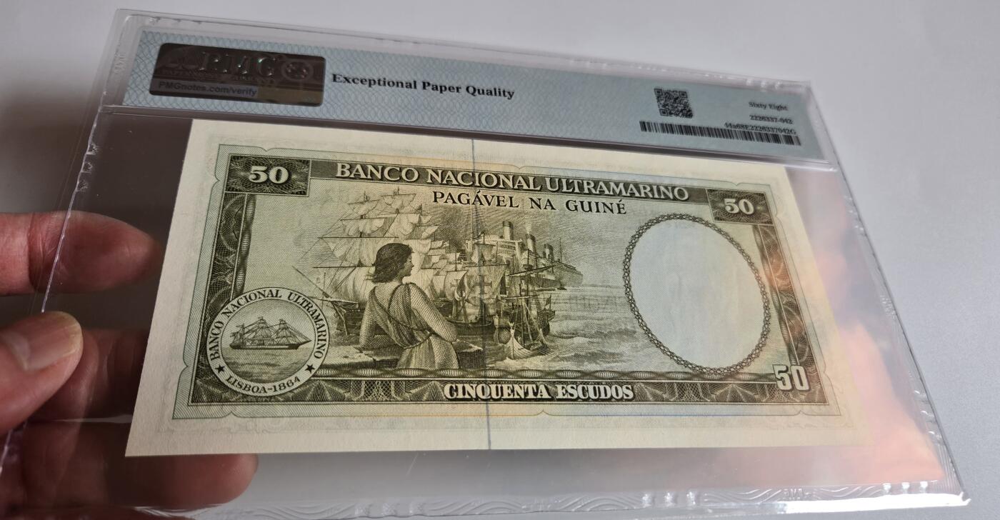 pmg评级币 葡属几内亚50埃斯库多  pmg68 亚军分 冠军分只有一张 无347靓号 探险家、奴隶商人努诺·特里1971