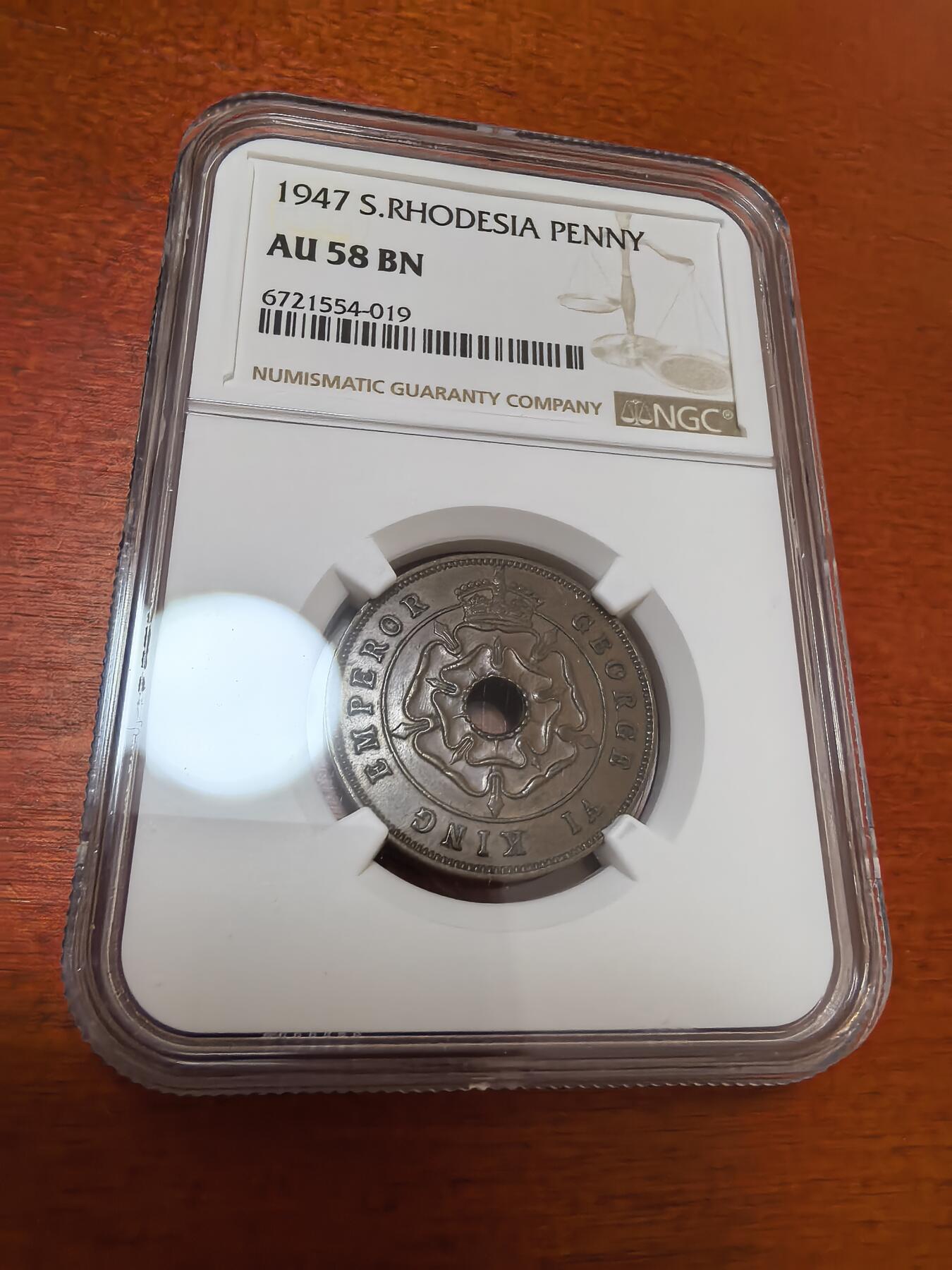 长老汇蛇年精选第四十四场拍卖 1947南罗德西亚1便士中孔铜币，NGC AU58BN，更高分仅有7枚