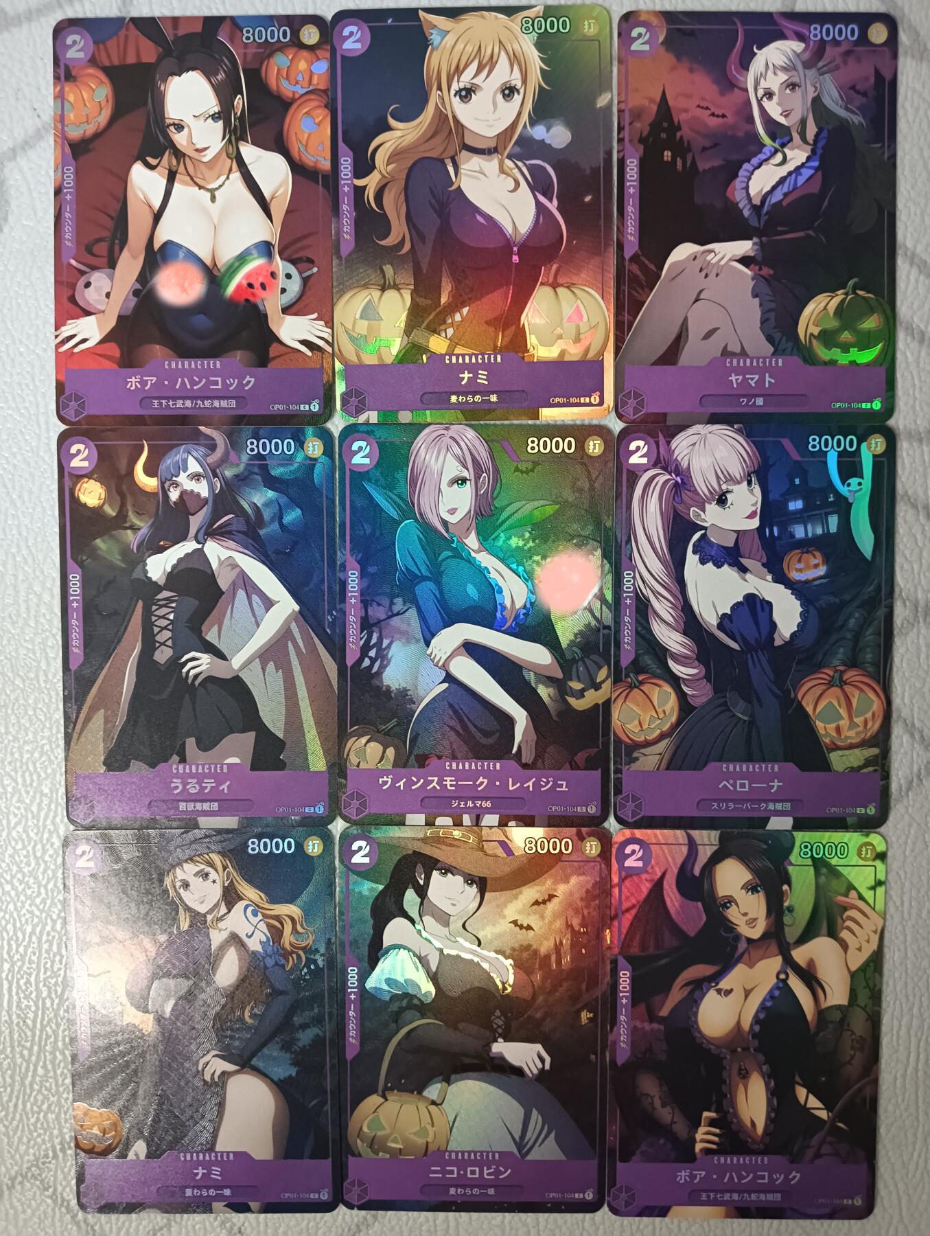 花开卡拍第38期（9月14号周日截拍，品控勿拍!!!拍品不寄存，运费5元，自制卡难免瑕疵，可能存在轻微撞角爆边等出厂瑕疵，品控介意勿拍！） 嘎嘎鸭海贼王系列折光彩闪卡 全女角色，9张