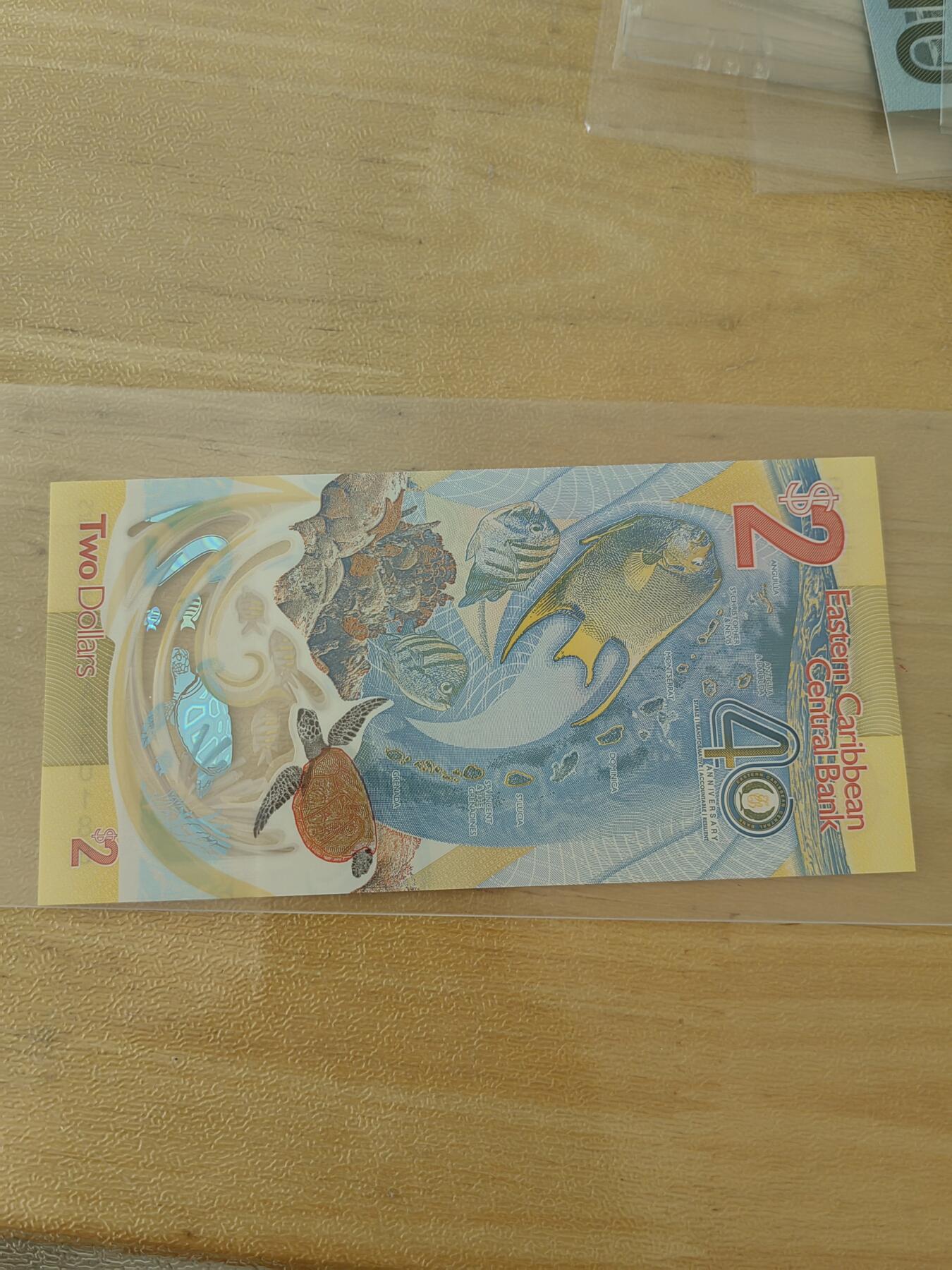 斯努比★部分UNC外币处理 东加勒比2 获奖钞AA830188