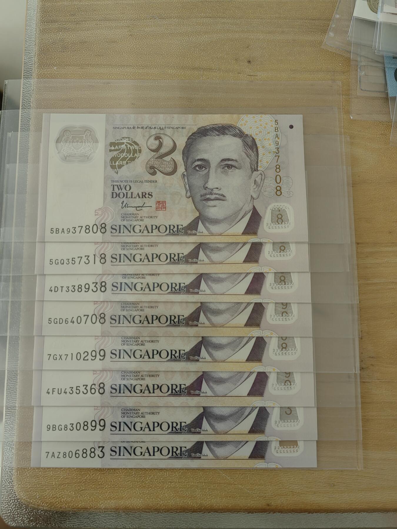斯努比★部分UNC外币处理 新加坡2元 8张 NUC 号码不错