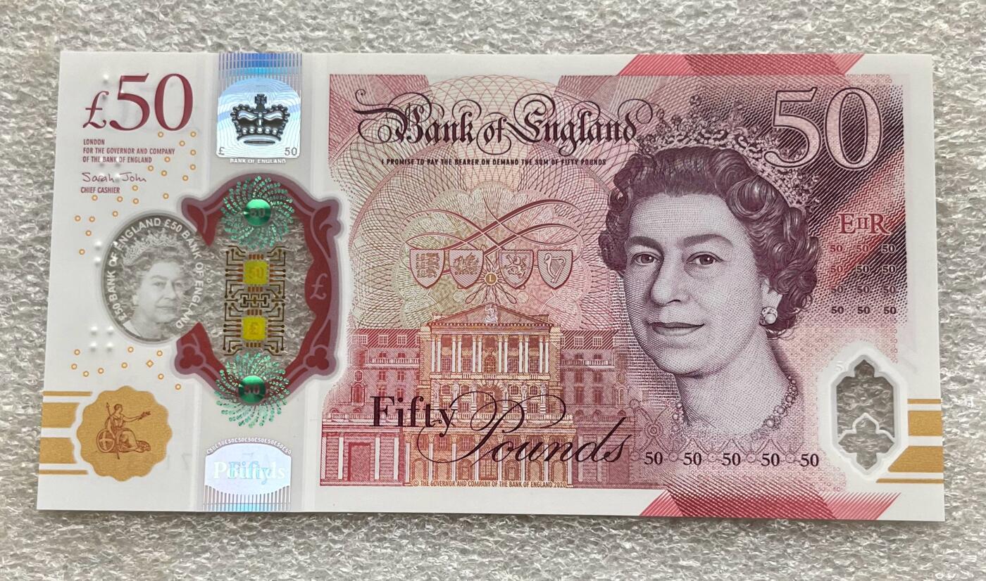 日本战争债券、英国伊二女王末版纸币套、哈萨克斯坦2万坚戈纪念钞、民国钞、台湾经济振兴券，台湾原住民系列套币/生肖银币，新疆喀什饷银五钱，康熙/光绪铜钱，哈萨克斯坦精制纪念银币，荷属东印度爪哇岛小铜块。彼得堡世界钱币勋章拍卖第133期 英国2020年50镑纸币塑料钞、艾伦·图灵，UNC全新品相、透明窗口完好
