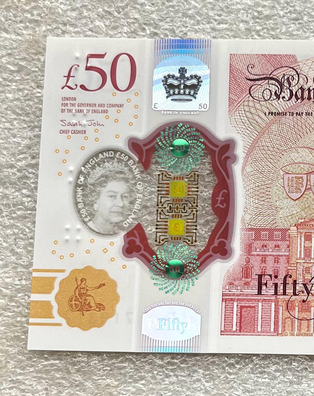 日本战争债券、英国伊二女王末版纸币套、哈萨克斯坦2万坚戈纪念钞、民国钞、台湾经济振兴券，台湾原住民系列套币/生肖银币，新疆喀什饷银五钱，康熙/光绪铜钱，哈萨克斯坦精制纪念银币，荷属东印度爪哇岛小铜块。彼得堡世界钱币勋章拍卖第133期 英国2020年50镑纸币塑料钞、艾伦·图灵，UNC全新品相、透明窗口完好