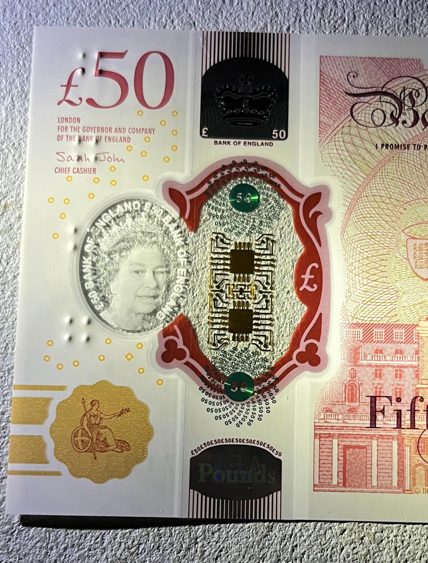 日本战争债券、英国伊二女王末版纸币套、哈萨克斯坦2万坚戈纪念钞、民国钞、台湾经济振兴券，台湾原住民系列套币/生肖银币，新疆喀什饷银五钱，康熙/光绪铜钱，哈萨克斯坦精制纪念银币，荷属东印度爪哇岛小铜块。彼得堡世界钱币勋章拍卖第133期 英国2020年50镑纸币塑料钞、艾伦·图灵，UNC全新品相、透明窗口完好