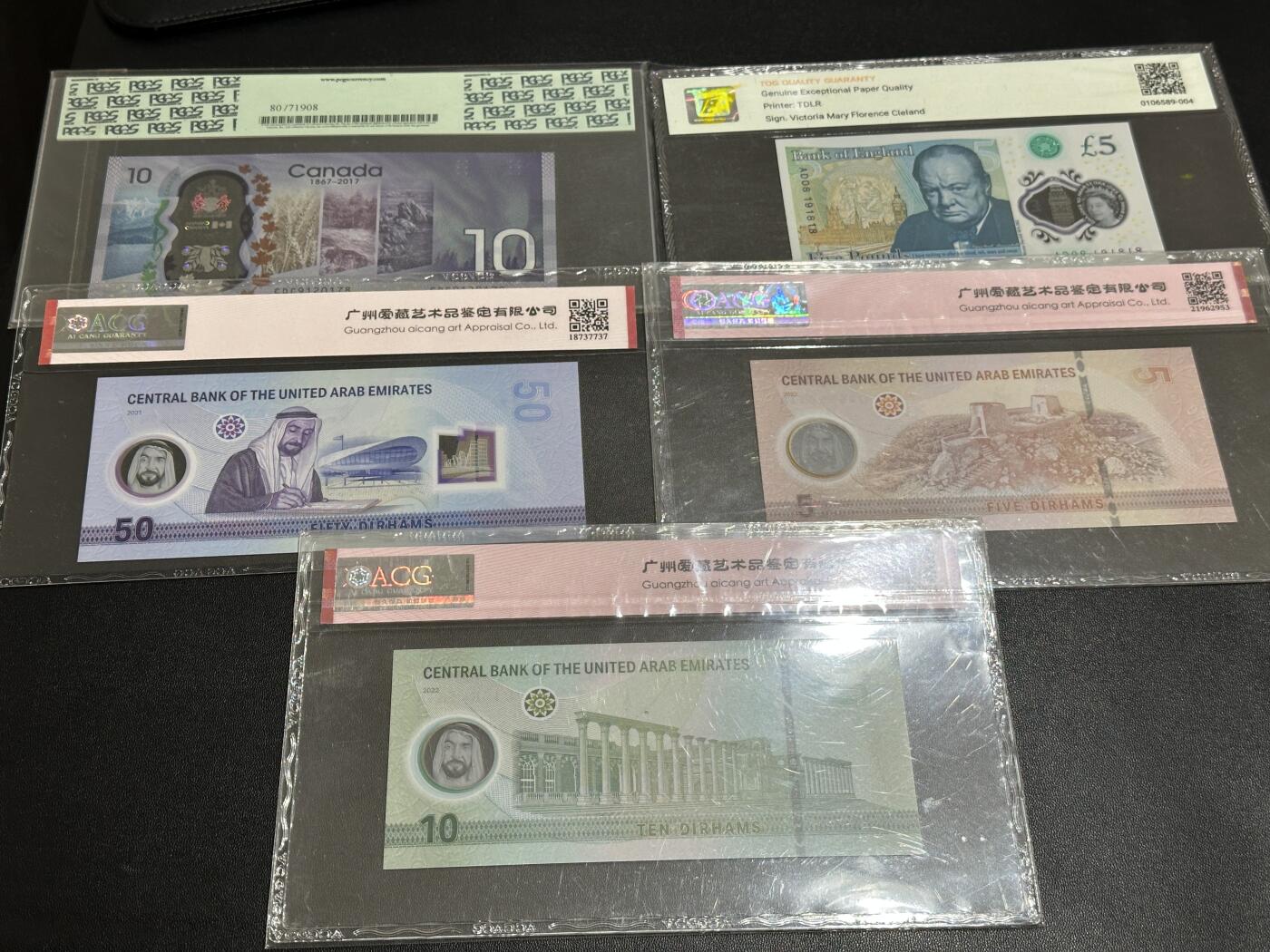 《外钞收藏家》第五百六十七期（本期精选优质品种，欢迎参加）（本平台长期征集拍品、欢迎藏友们联系合作） 加拿大纪念钞10元 绿标PCGS+英国女王塑料钞5镑 倒置号 TQG评级+阿联酋5、10、50 三张一起 爱藏评级