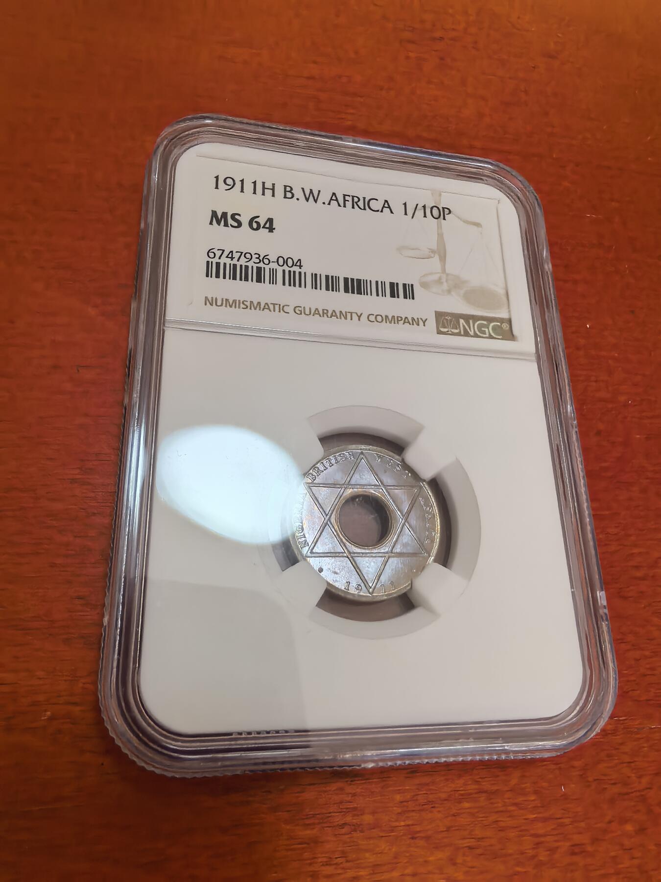 长老汇蛇年精选第四十七场拍卖 1911西非1/10便士中空铜镍币，NGC MS64
