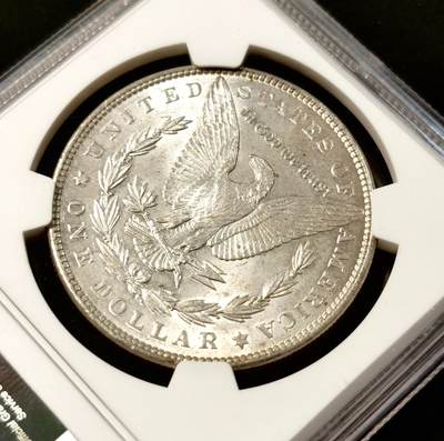甄臻铺-世界币章拍卖（第34期），送拍享返佣金等优惠多多 NGC-MS63 美国1886摩根银元 带一点淡淡的包浆 底板不错 个人送评 上海N有点压分了 状态很不错