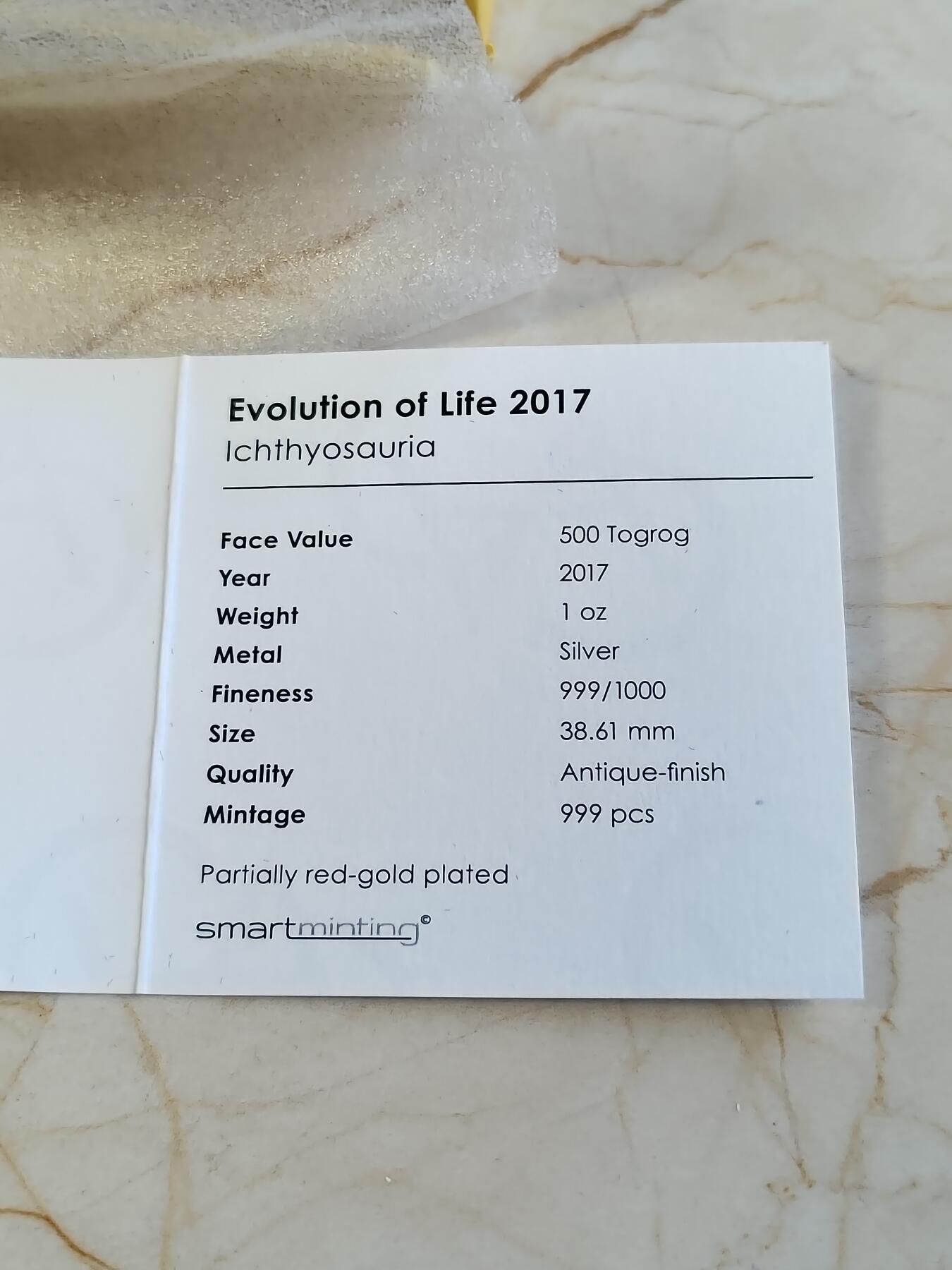 第176期拍卖【长期征集拍品】【欢度国庆中秋双节】 蒙古2017年生命进化系列鱼龙镀金仿古纪念1盎司银币带盒证书，999银，发行量999枚，