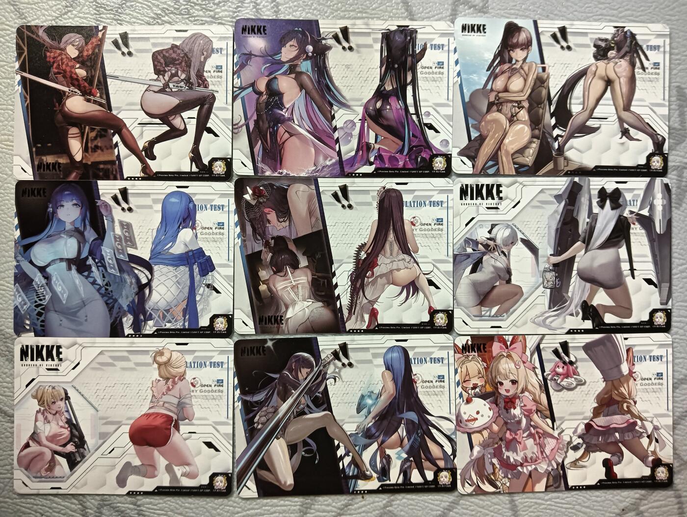 花开卡拍第39期（9月21号周日截拍，品控勿拍!!!拍品不寄存，运费5元，自制卡难免瑕疵，可能存在轻微撞角爆边等出厂瑕疵，品控介意勿拍！） 姬闪卡 胜利女神nikke彼女与剑套卡  9+1卡头 卡背为战斗视角图