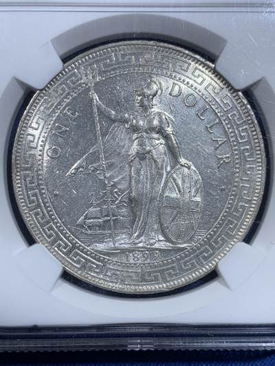 《竞宝斋》第420场 周日，周一，周二  3场连拍 （全场包邮） NGC UNC 英国1899年B版站洋壹元银币 底板转光 状态好 细节见图