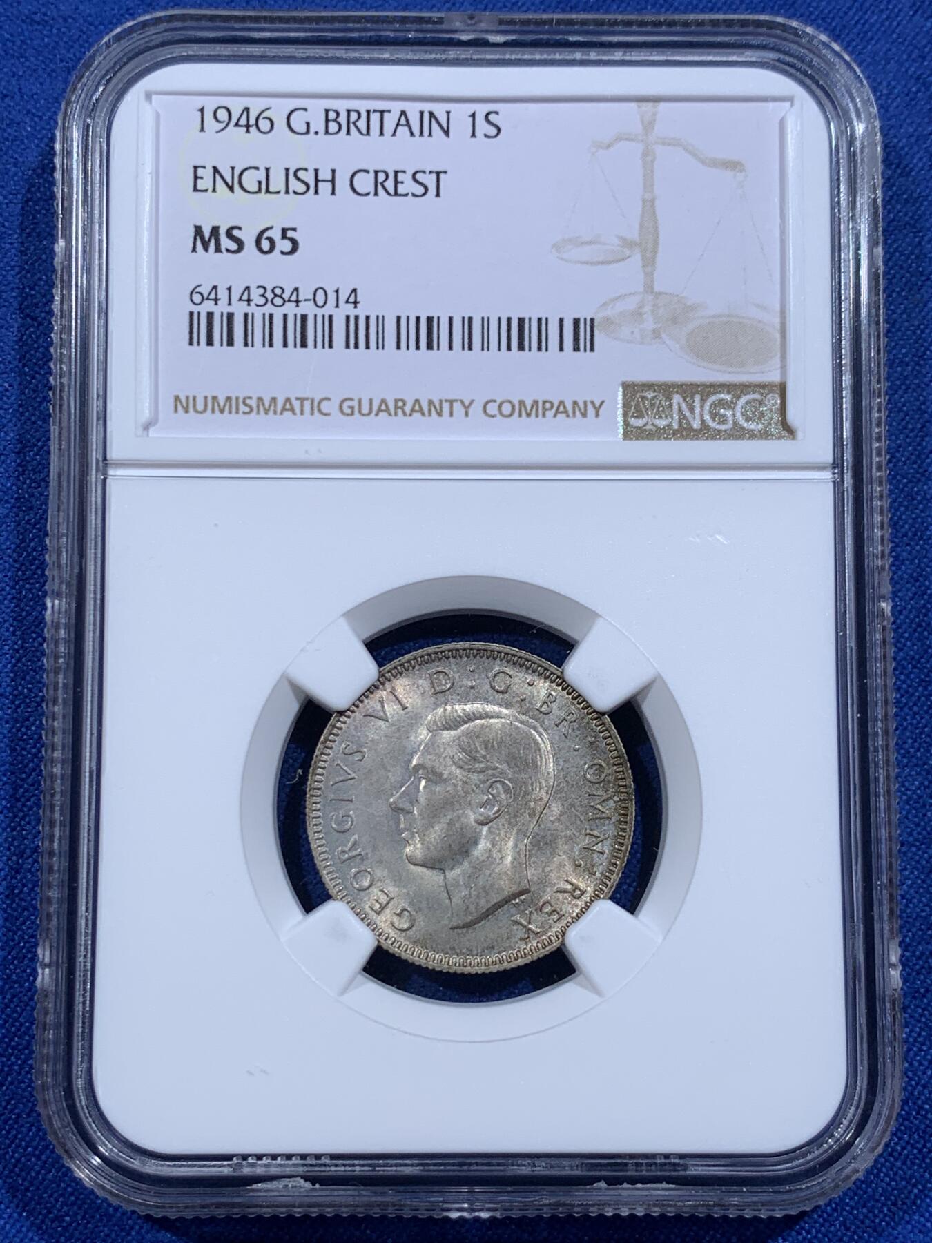 《竞宝斋》第421场 周日，周一，周二  3场连拍 （全场包邮） NGC MS65 英国1946年乔六1先令银币，英格兰站狮版。流通版上65分难度不用多说，此枚是自送10几枚中唯一的1枚65分。英系玩家流通套必备，无需换藏的分数。