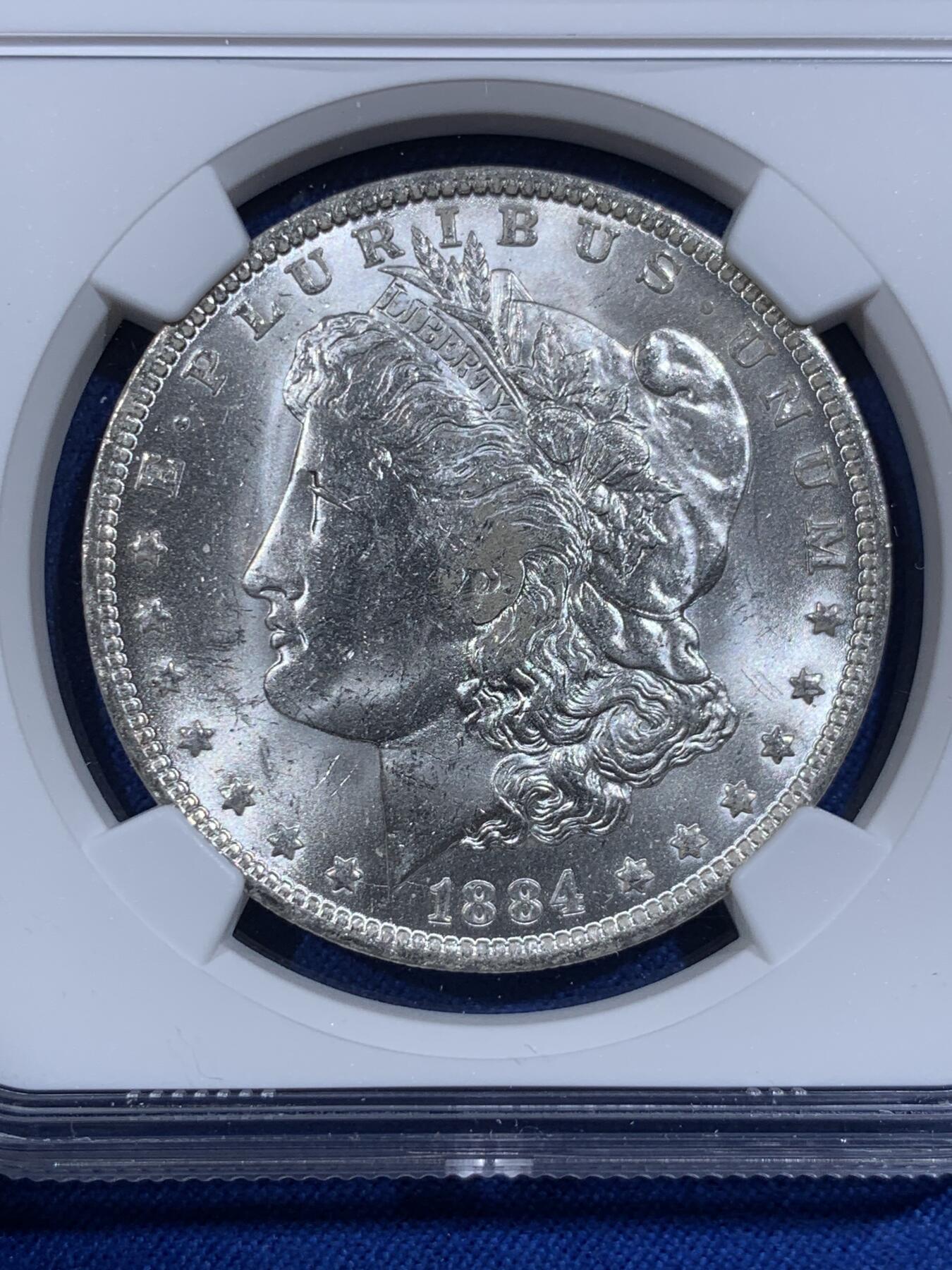 《竞宝斋》第421场 周日，周一，周二  3场连拍 （全场包邮） NGC MS63 美国1884年O版摩根银币，币面干净利落，非常漂亮。