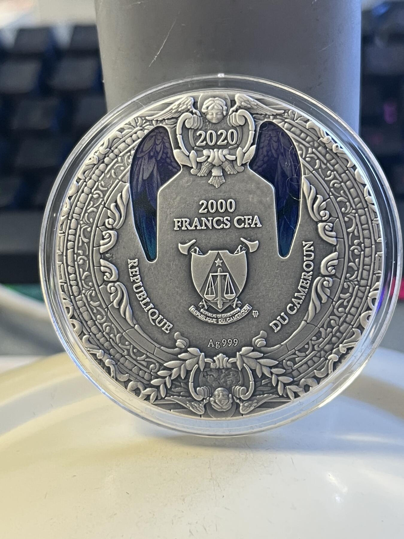 第176期拍卖【长期征集拍品】【欢度国庆中秋双节】 喀麦隆2020年天使系列1加百列镶彩玻璃2盎司银币，999银，发行500枚