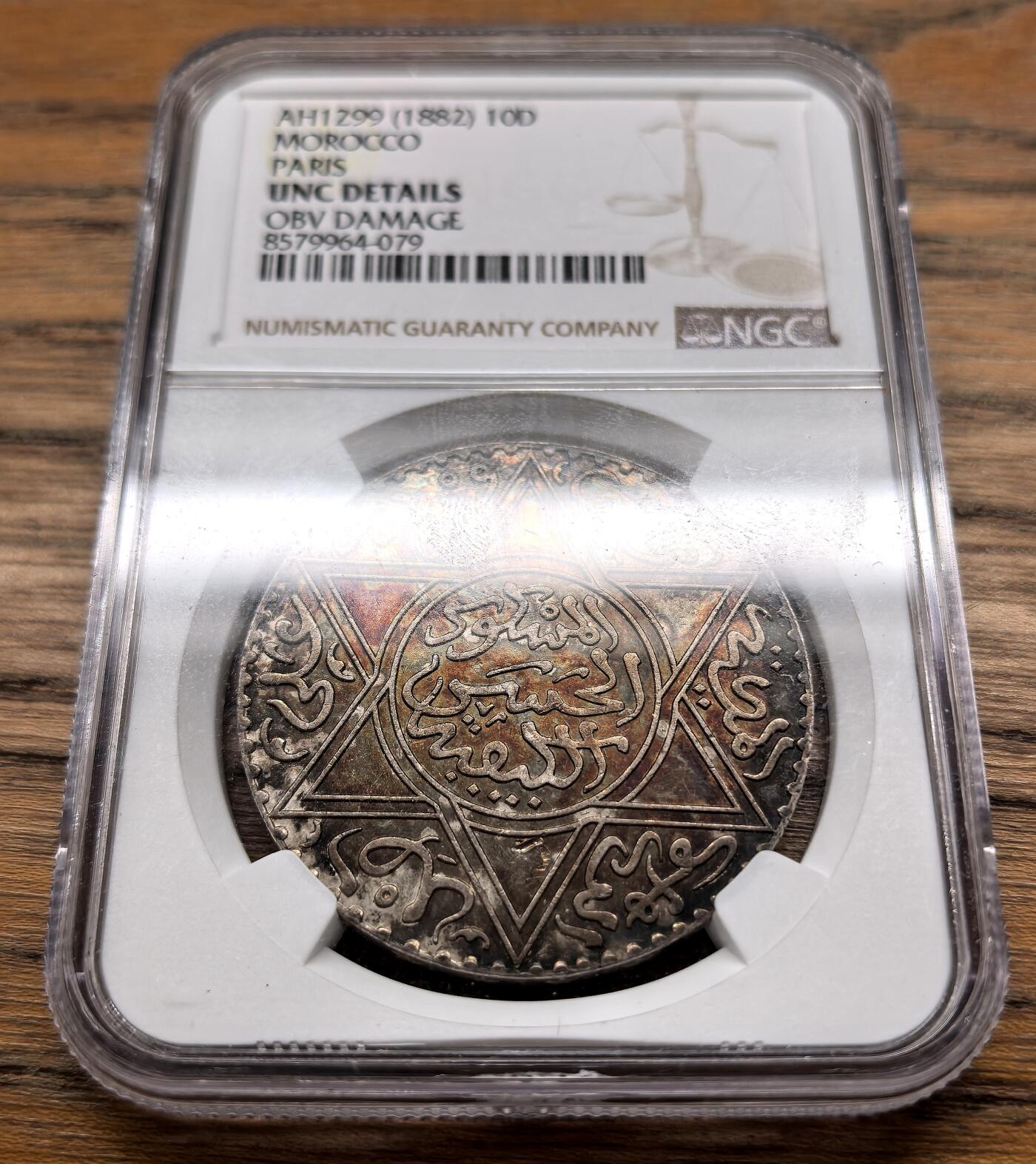 凡希社世界钱币微拍月度大拍（2025/09） AH1299（1882）摩洛哥10Dinar大银NGC-UNCD，稀有版别仅次于AH1313，会洗的可以试试重评。