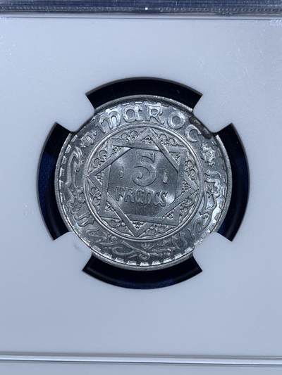《竞宝斋》第423场 周日，周一，周二  3场连拍 （全场包邮） NGC MS66 摩洛哥1950年5法郎 少见高分 两面转光 图案富有阿拉伯国家风情 一步到位的品相
