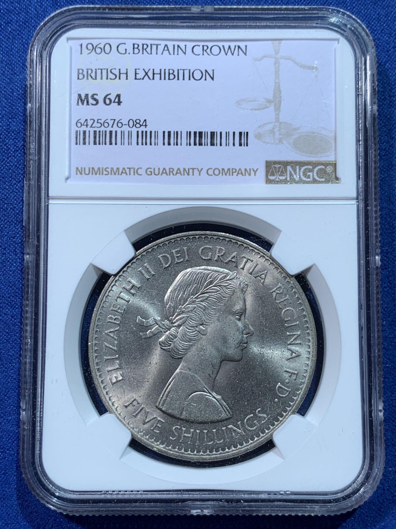 《竞宝斋》第424场 周日，周一，周二  3场连拍 （全场包邮） NGC MS64 英国1960年英伦展销会大克朗，女王年轻头像+精美盾徽，转光流畅，比1953年的登基版少见太多。越来越不好收的一版克朗，潜力大。