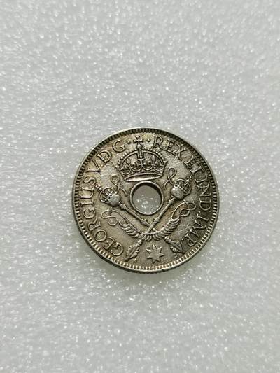 天下钱庄专场欢迎参拍 - 新几内亚中孔银币