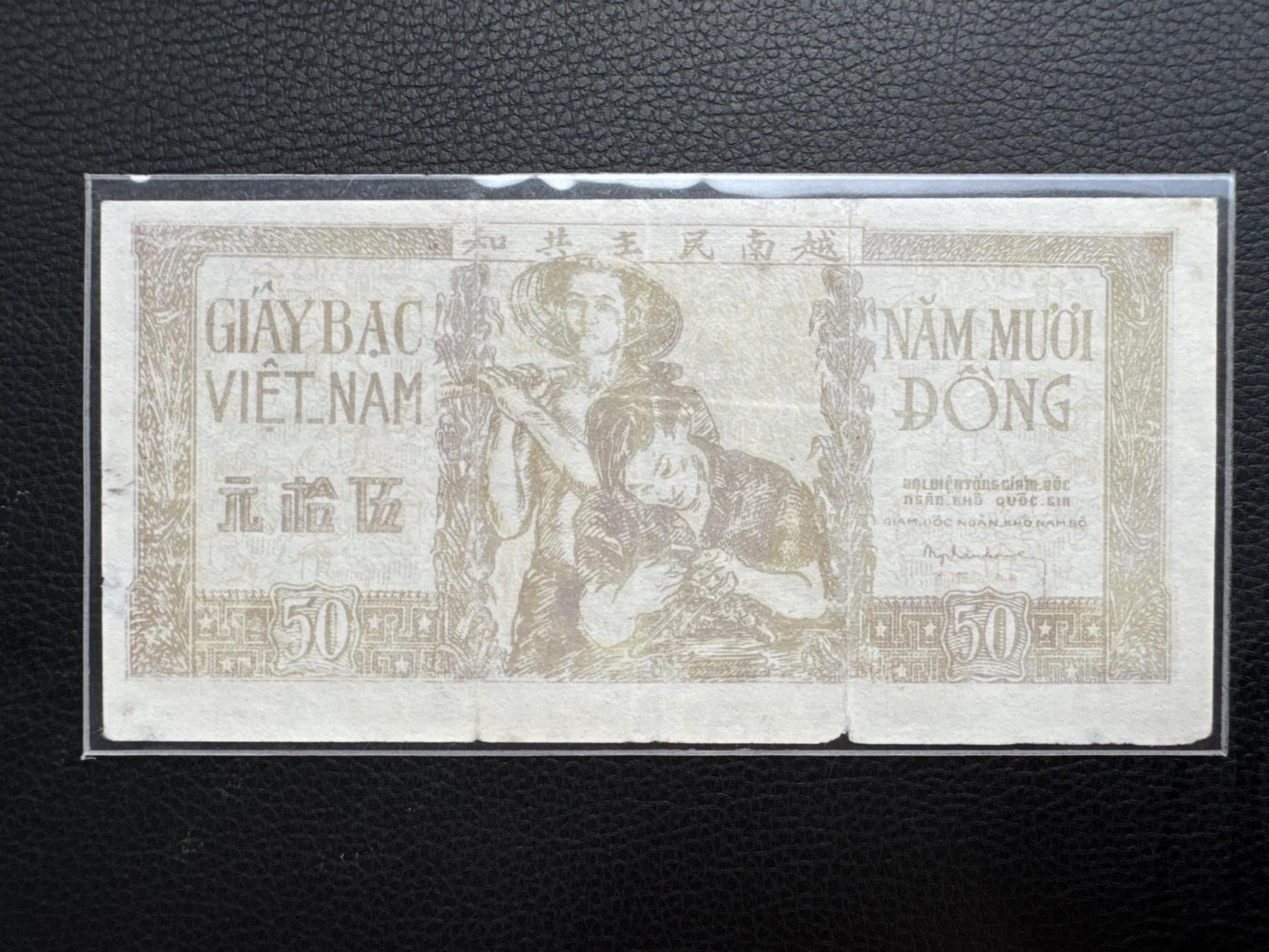 桂P钱币文化工作室拍卖第四十三期 越南民主共和国早期草纸票伍拾元，颜色偏淡，可能洗过