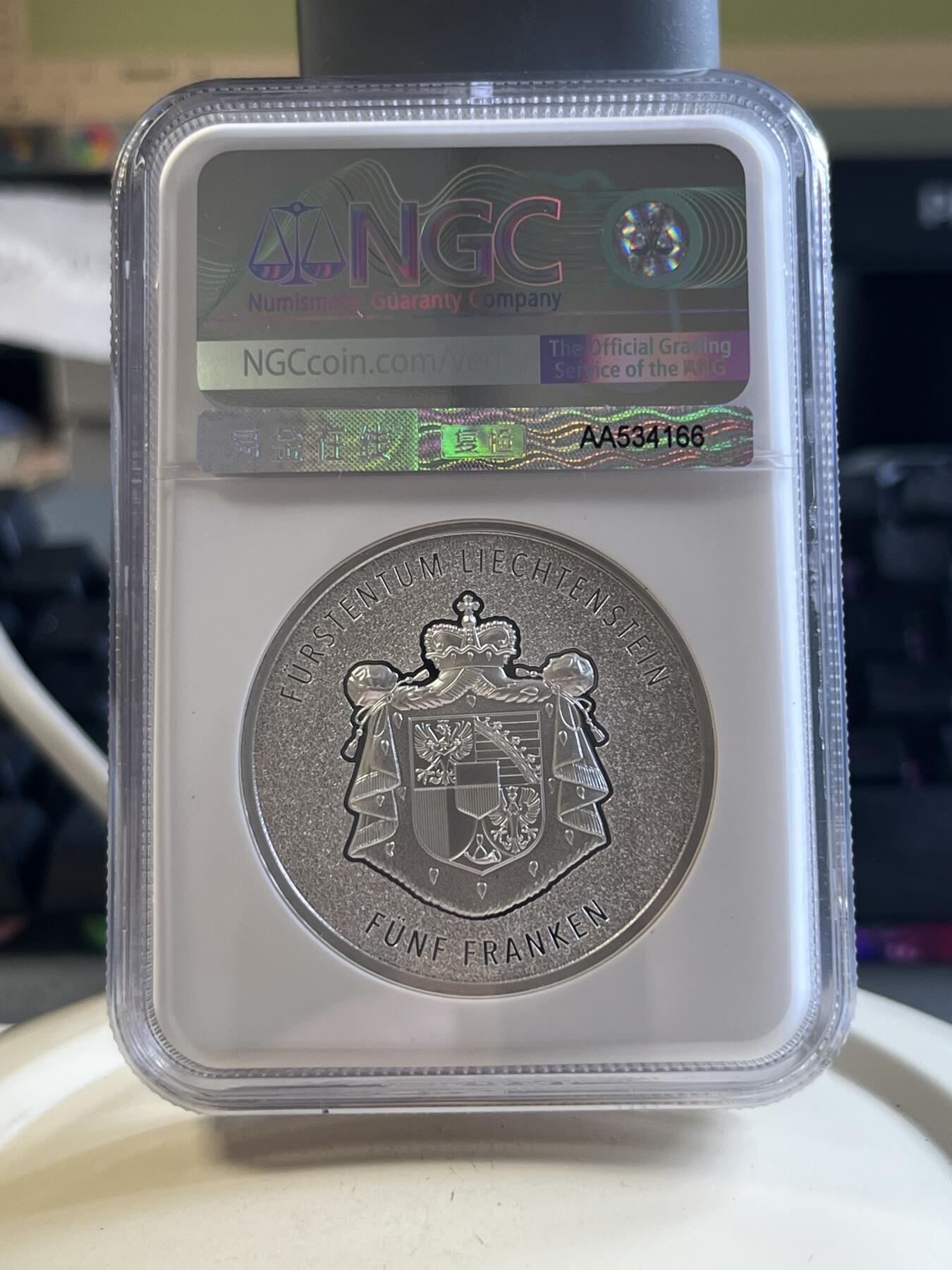 第177期拍卖【长期征集拍品】 首期蓝标NGC-MS70 列支敦士登2024年发行的瑞士法郎作为本国货币100周年彩银纪念币-5法郎（CIT超高浮雕工艺，1盎司克重，999纯银，限量发行5千枚，盒证齐全）