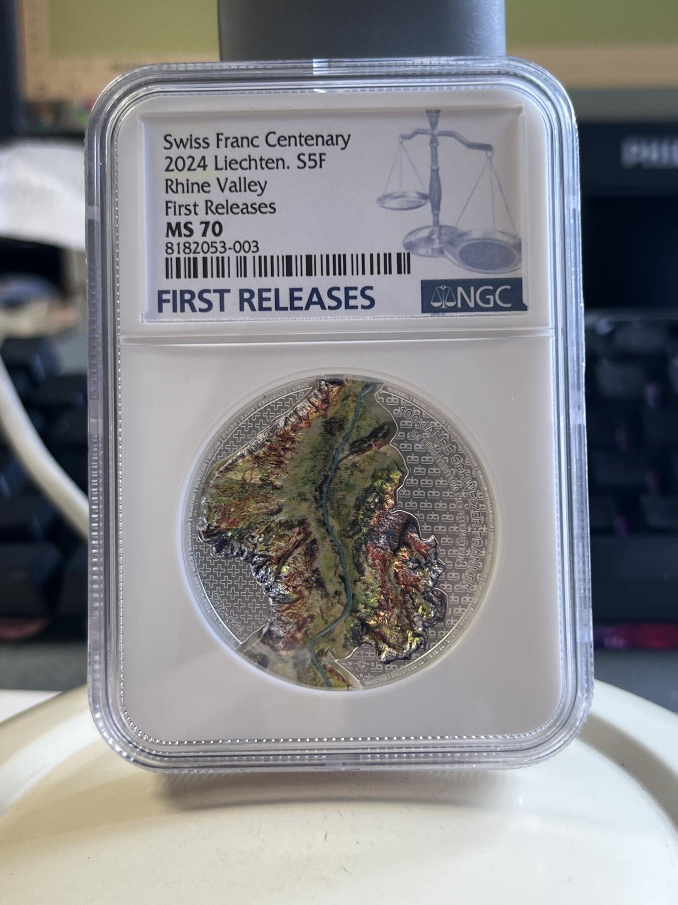第177期拍卖【长期征集拍品】 首期蓝标NGC-MS70 列支敦士登2024年发行的瑞士法郎作为本国货币100周年彩银纪念币-5法郎（CIT超高浮雕工艺，1盎司克重，999纯银，限量发行5千枚，盒证齐全）