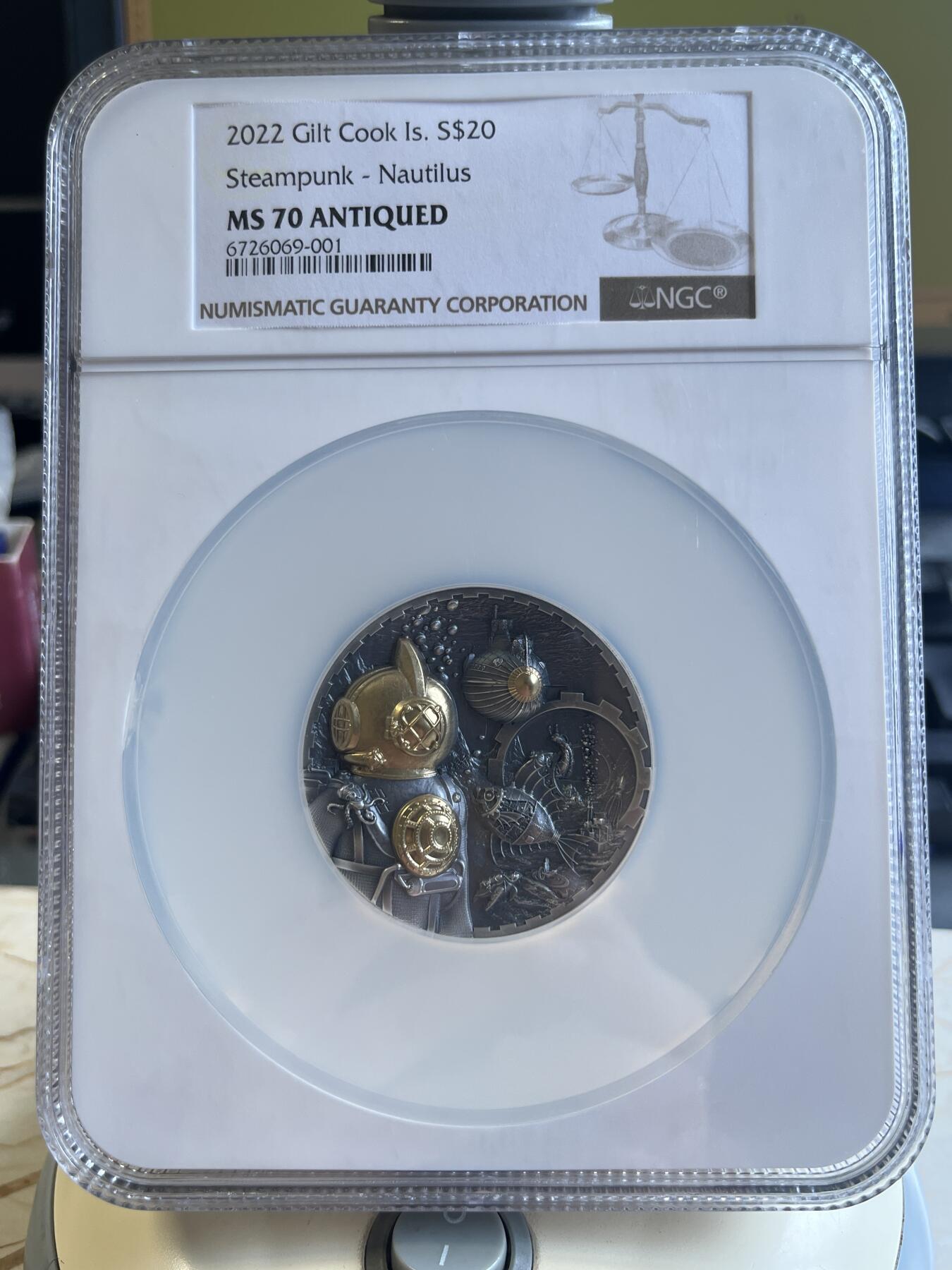 第177期拍卖【长期征集拍品】 NGC-PF70ULTRA CAMEO 库克2022年发行蒸汽朋克系列-鹦鹉螺浮雕镀金仿古纪念银币（超高浮雕效果震撼，3盎司克重，币径50MM，限量发行888枚，加厚大盒，拥有上天下海的能力一直是人类挑战未知世界的渴望，这枚里面寓意着人类挑战海洋成功！），无盒无证书