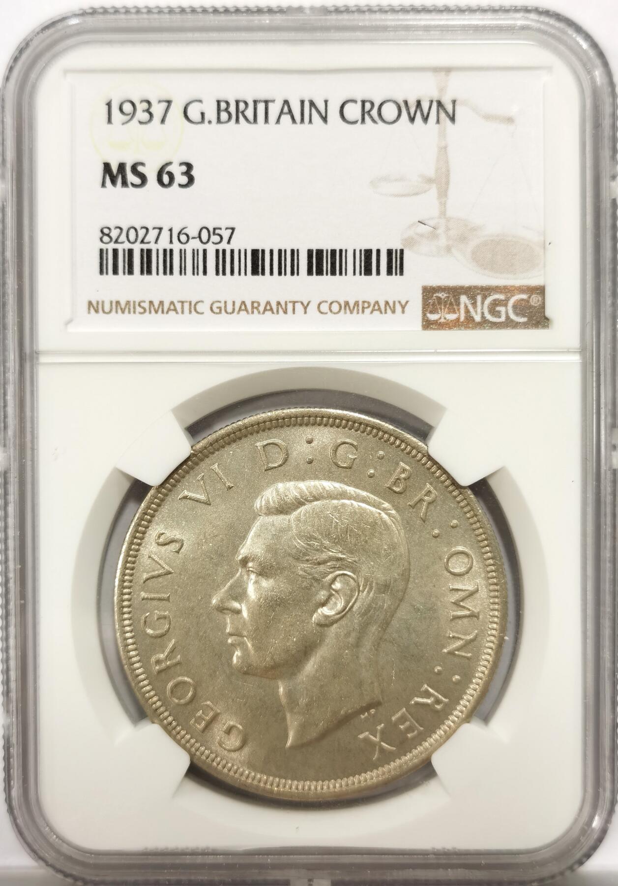 博洋堂世界钱币拍卖第143期（全场包邮） NGC MS63 英国1937年乔治六世登基1克朗银币，原汁原味老包浆，包浆醇厚，打制深峻，转光强烈细节优秀，状态极佳。