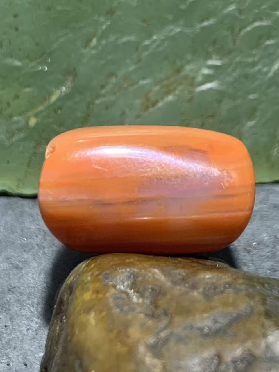 柿子红千层纹南红玛瑙通货随形珠一颗，