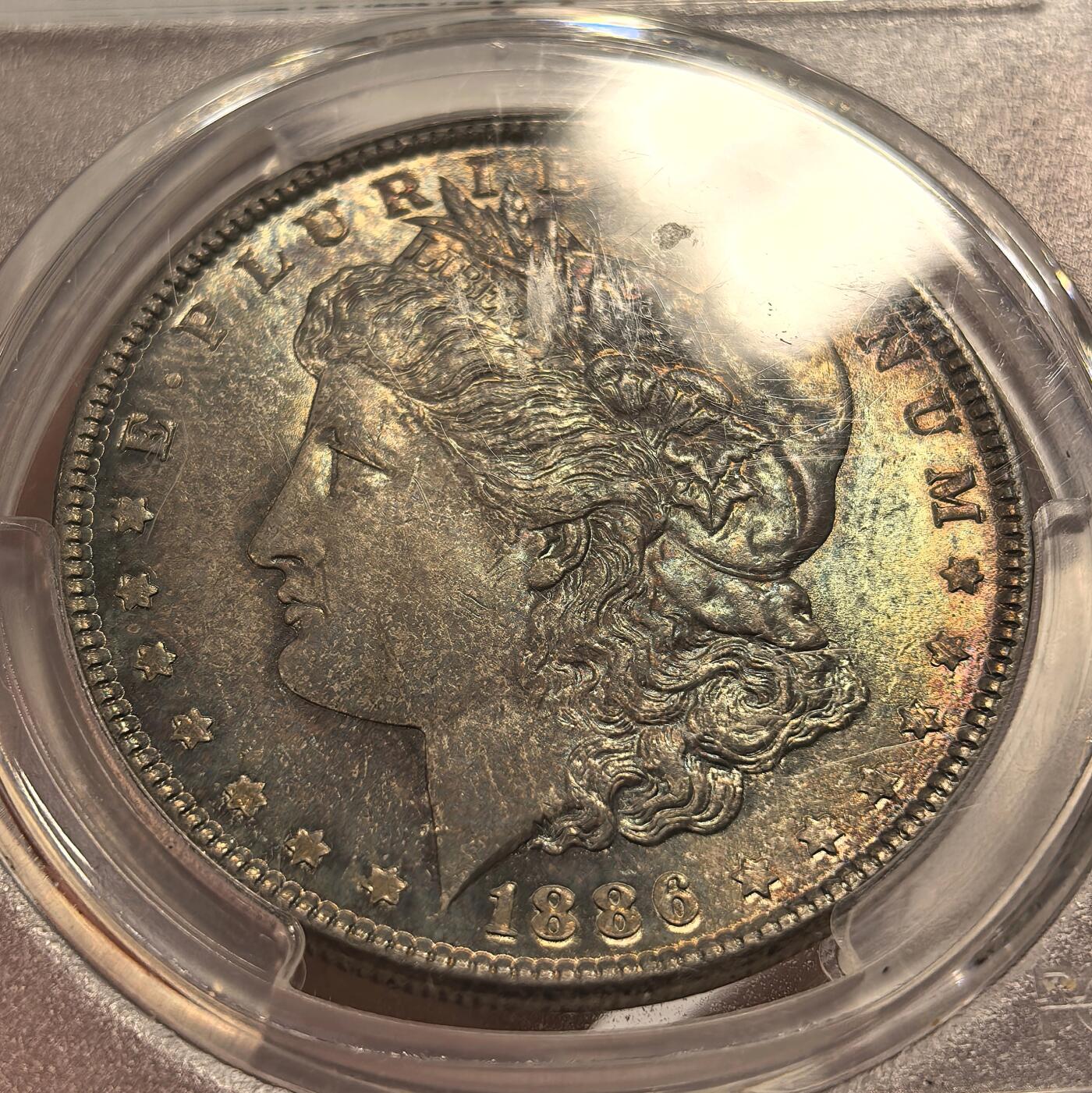 博洋堂世界钱币拍卖第143期（全场包邮） PCGS MS64 美国1886年摩根银币P版，原汁原味双面五彩老包浆，包浆醇厚润泽又犀利，打制深峻，味道币味道足，状态一流。