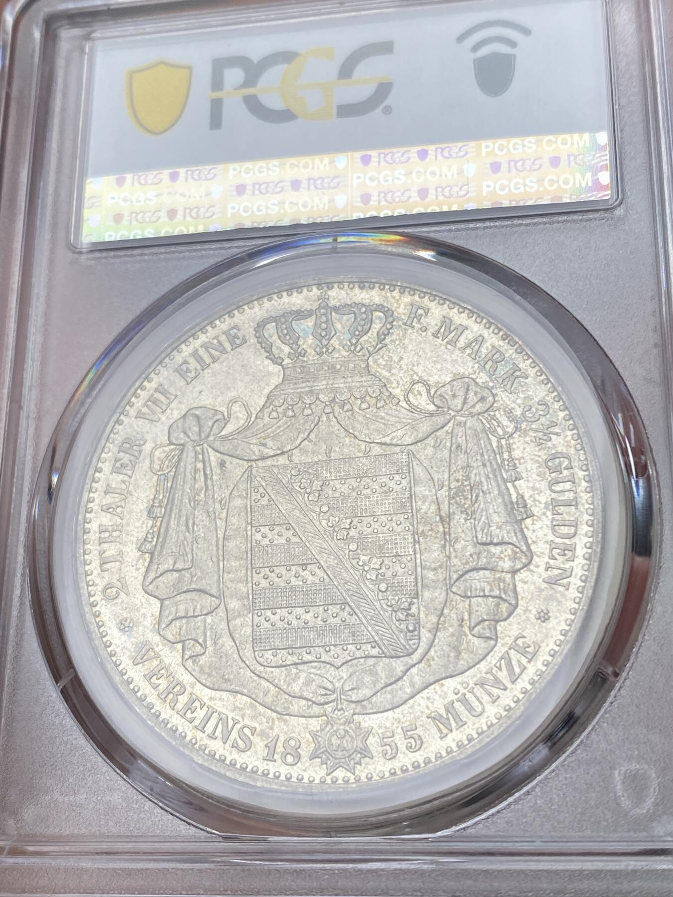 万国钱币拍卖第053期【万国秋季大拍下●周五周六两场连拍】 PCGS MS65PL 1855年萨克森流通纹章2泰勒 工艺明显区别与普通流通版本的一枚 无限接近于PF的质感 底板深度镜面 人像和纹章喷砂感极强 实物上手非常明显 应该也很难再找出类似状态的一枚了 NGC&PCGS双料冠军分