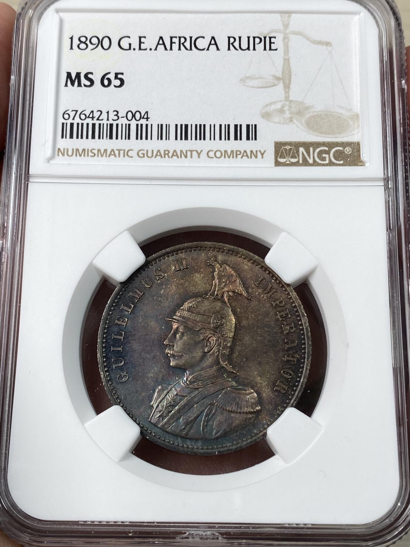 万国钱币拍卖第053期【万国秋季大拍下●周五周六两场连拍】 NGC MS65 1890年德属东非威廉二世军装1卢比 浓郁五彩顶级BU品质 永不换藏的天花板级别品相