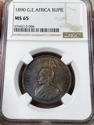 万国钱币拍卖第053期【万国秋季大拍下●周五周六两场连拍】 - NGC MS65 1890年德属东非威廉二世军装1卢比 浓郁五彩顶级BU品质 永不换藏的天花板级别品相