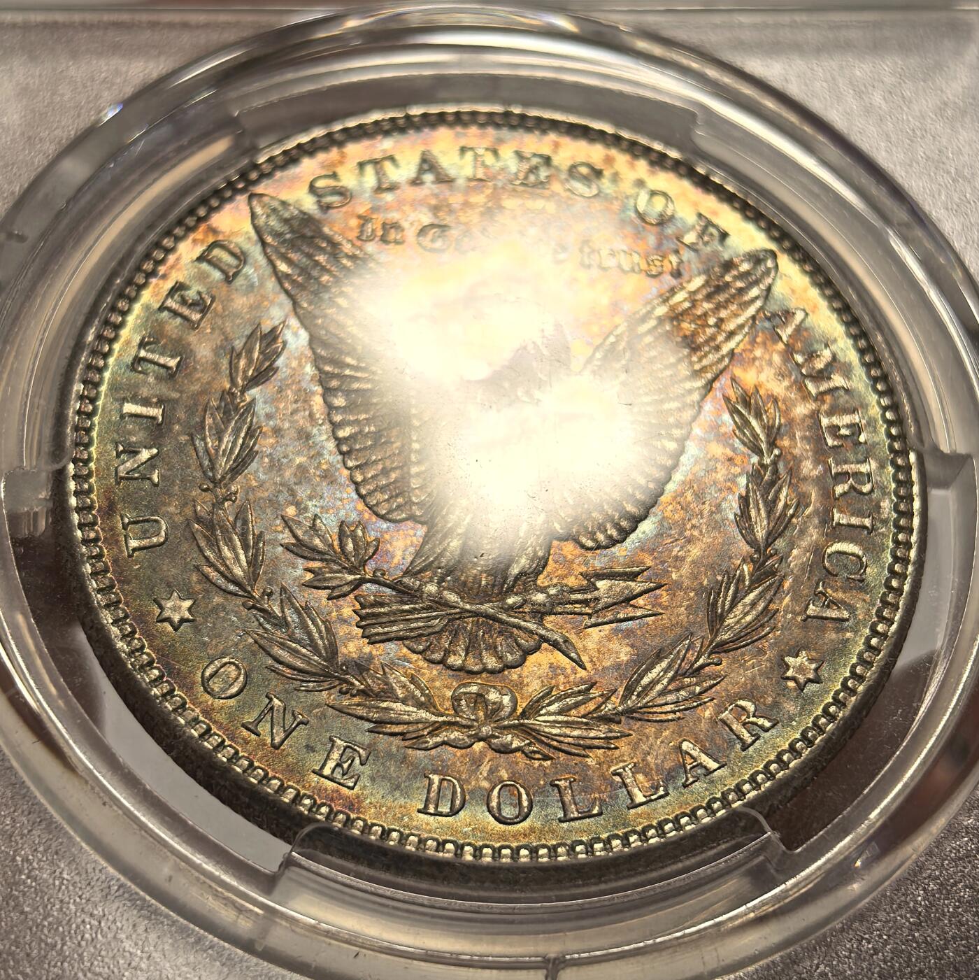 博洋堂世界钱币拍卖第143期（全场包邮） PCGS MS65 美国1885年摩根银币P版，原汁原味双面五彩老包浆，包浆醇厚润泽又犀利，打制深峻，转光强烈细节优秀，状态一流。