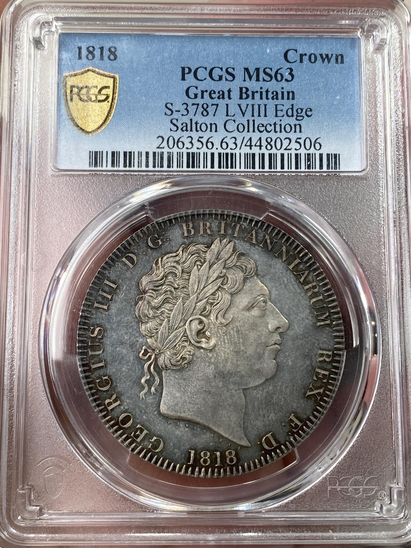 万国钱币拍卖第053期【万国秋季大拍上●周五周六两场连拍】 PCGS MS63 1818年英国乔治三世马剑克朗 英国马剑系列首年开山之作 打制锋利初铸感极强 类镜面质感的底板在英系渐变五彩的加持下绝对称得上是视觉享受 Salton名家旧藏 国际市场涨幅非常明显的品种