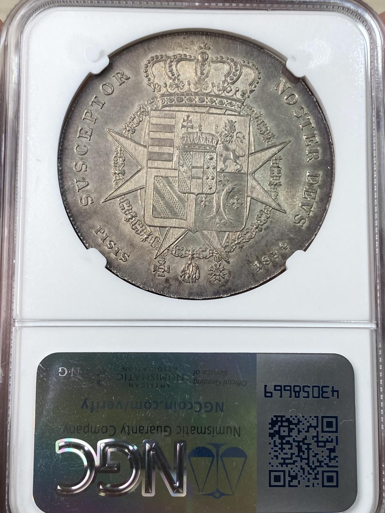 万国钱币拍卖第053期【万国秋季大拍上●周五周六两场连拍】 NGC MS63 1834年意大利托斯卡纳大公国利奥波德二世4费奥里尼大银 正面为青年版的利奥波德二世，背面为哈布斯堡洛林家族繁复精美的盾徽。全深打状态，均匀暗金色包浆，转光强烈，63中的佼佼者。结合了奥地利和意大利血统的一枚。后美第奇时代最经典的品种之一。今年6月MDC同分成交价约合人民币2.4w。