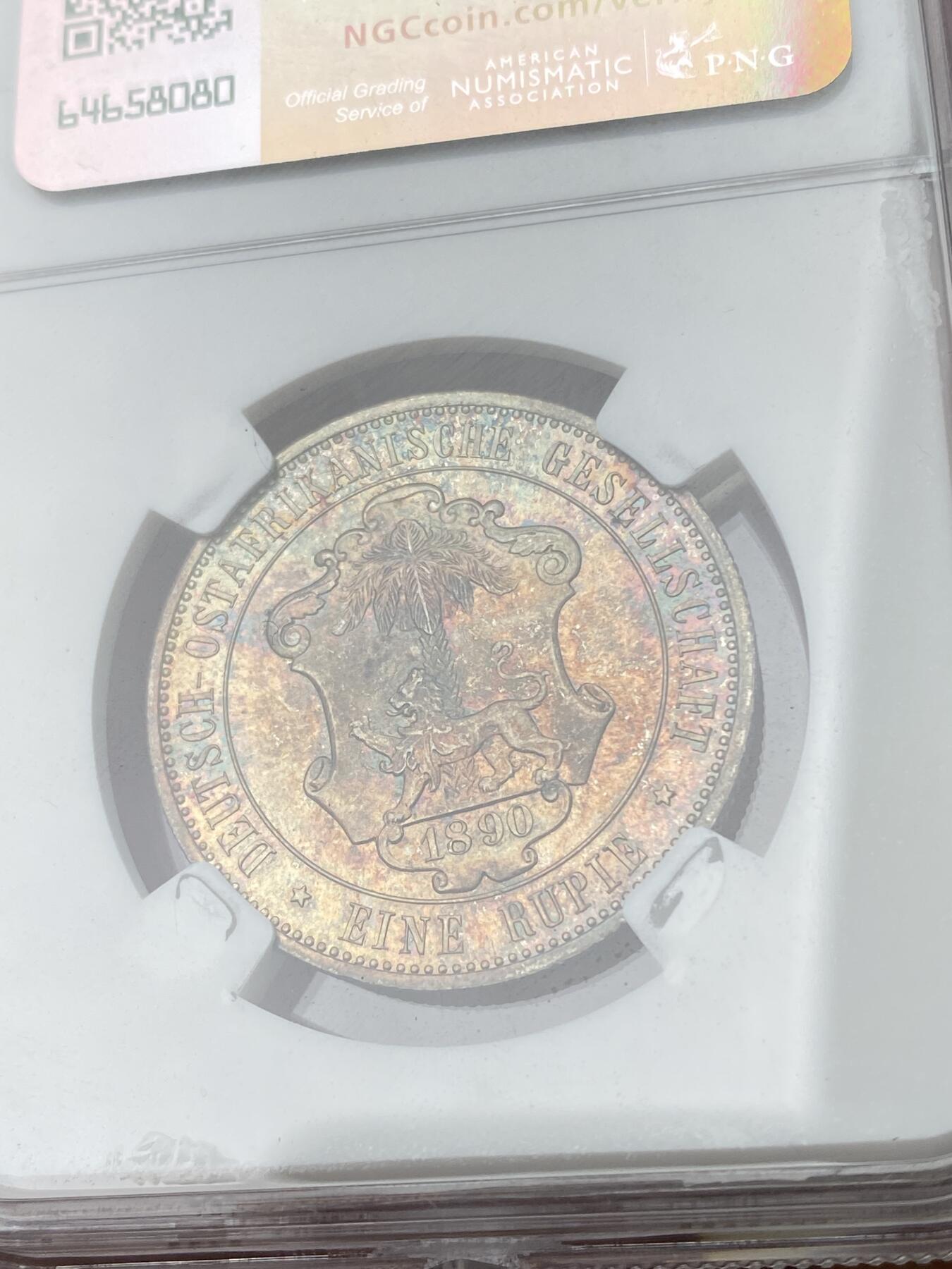 万国钱币拍卖第053期【万国秋季大拍下●周五周六两场连拍】 NGC MS65 1890年德属东非威廉二世军装1卢比 浓郁五彩顶级BU品质 永不换藏的天花板级别品相