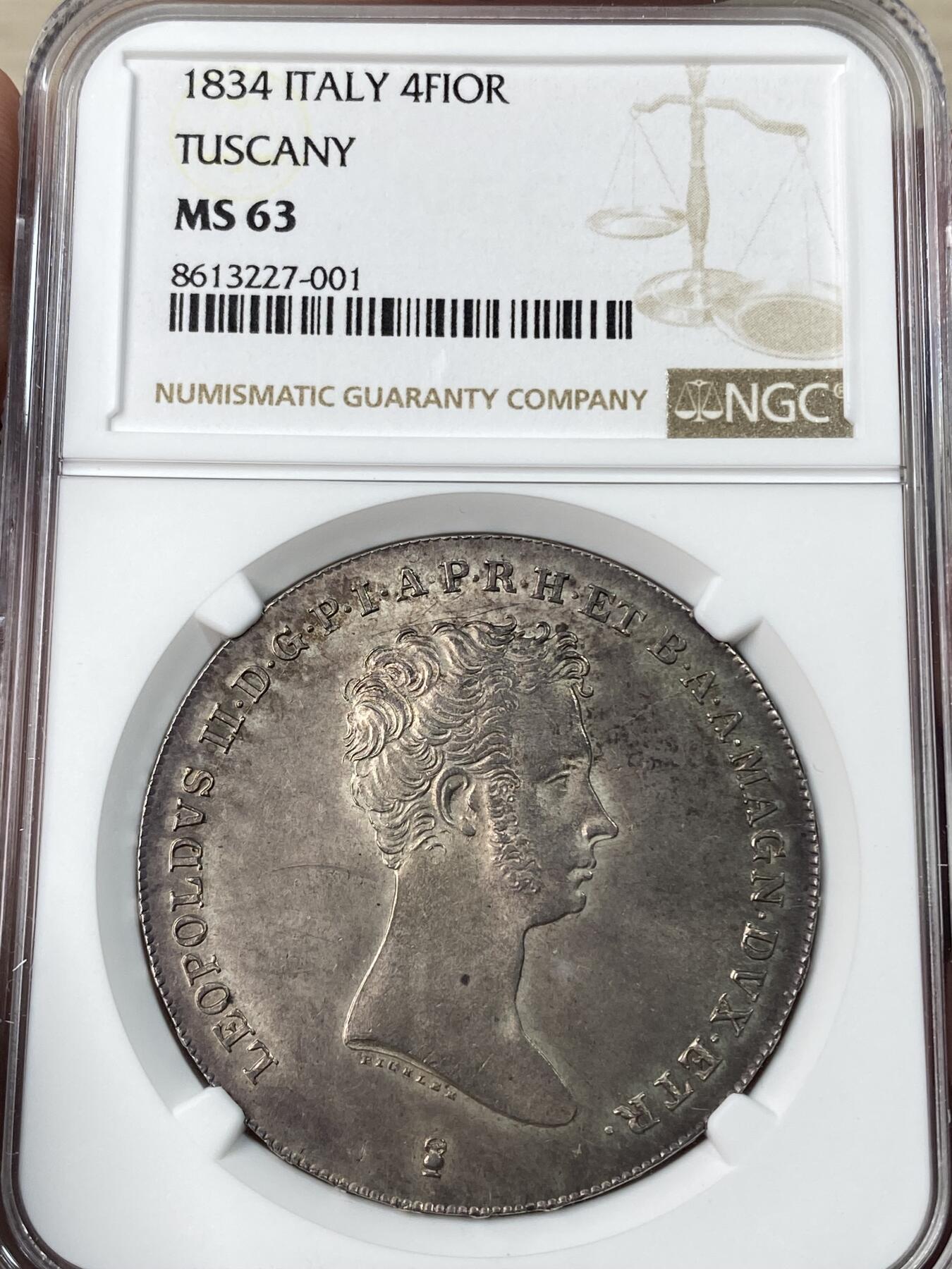 万国钱币拍卖第053期【万国秋季大拍上●周五周六两场连拍】 NGC MS63 1834年意大利托斯卡纳大公国利奥波德二世4费奥里尼大银 正面为青年版的利奥波德二世，背面为哈布斯堡洛林家族繁复精美的盾徽。全深打状态，均匀暗金色包浆，转光强烈，63中的佼佼者。结合了奥地利和意大利血统的一枚。后美第奇时代最经典的品种之一。今年6月MDC同分成交价约合人民币2.4w。