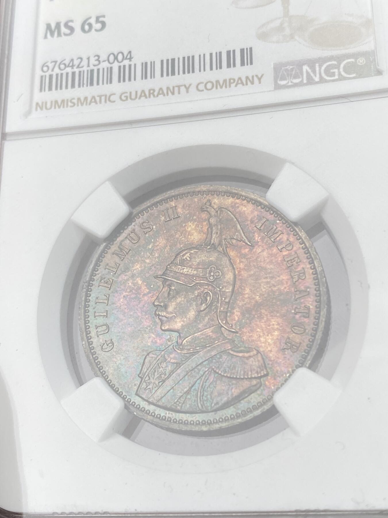 万国钱币拍卖第053期【万国秋季大拍下●周五周六两场连拍】 NGC MS65 1890年德属东非威廉二世军装1卢比 浓郁五彩顶级BU品质 永不换藏的天花板级别品相
