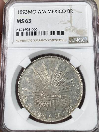 万国钱币拍卖第053期【万国秋季大拍上●周五周六两场连拍】 - NGC MS62 1893年墨西哥MO厂鹰洋8瑞尔 原光淡彩全羽