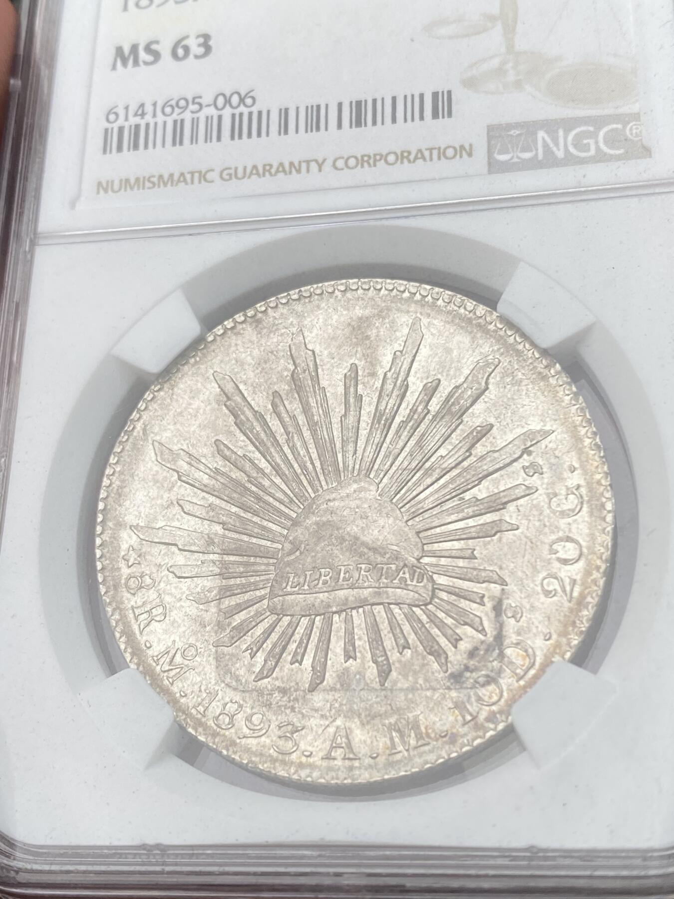 万国钱币拍卖第053期【万国秋季大拍上●周五周六两场连拍】 NGC MS62 1893年墨西哥MO厂鹰洋8瑞尔 原光淡彩全羽